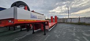 Низкорамный полуприцеп-тяжеловоз 94183-010