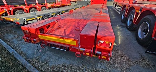 Низкорамный полуприцеп-тяжеловоз 94183-010