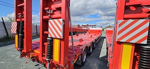 Низкорамный полуприцеп-тяжеловоз 94183-010